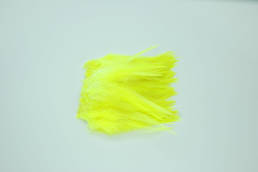 Strung Rooster Saddles Long - Fl.Yellow