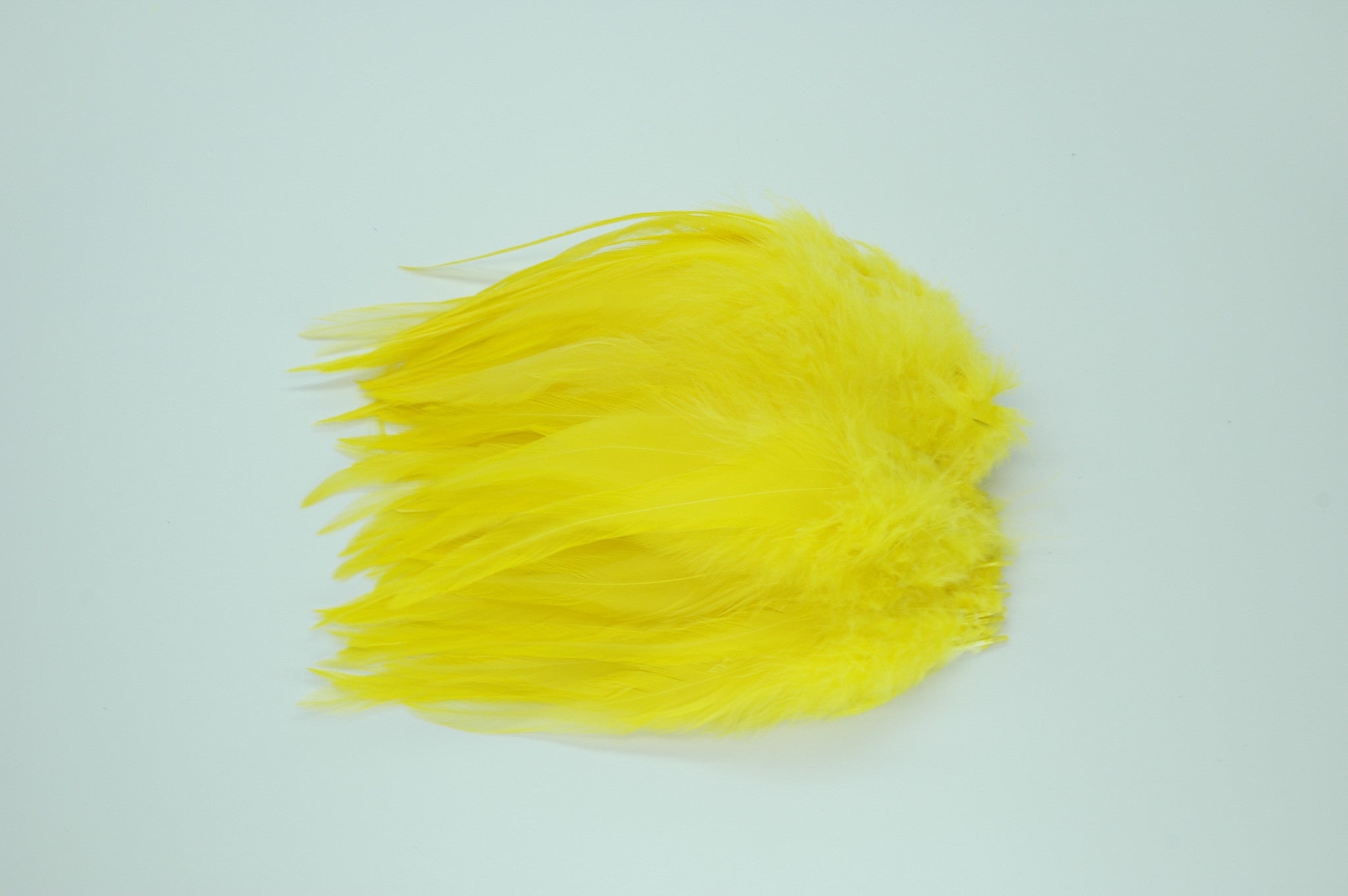 Strung Rooster Saddles Long - Yellow