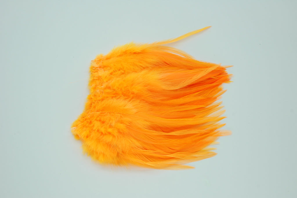 Strung Rooster Saddles Long - Fl. Orange